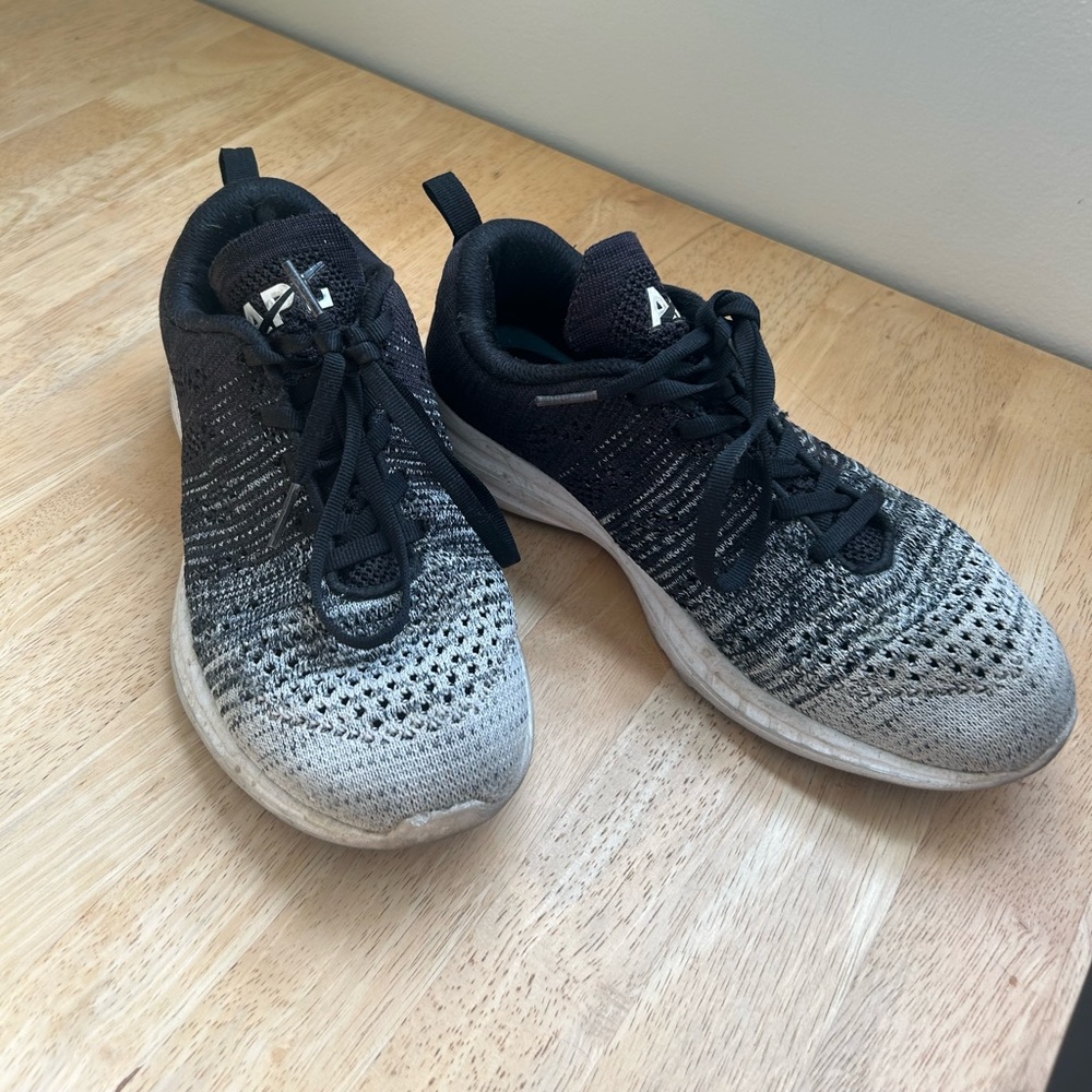 APL black and white texhloom tennis shoes.